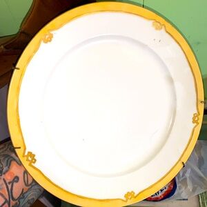 This is a Limoges gold rimmed collectible plate made in France